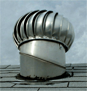 A rusty whirlybird roof ventilator.