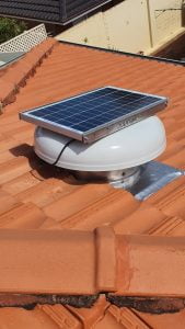 solar roof vent installed on a tin roof